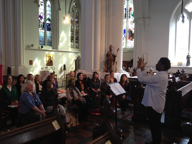 Aga leading Camberwell Community Choir at rehearsal