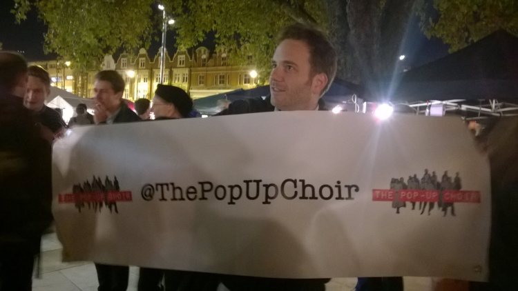Dom wields the Pop-Up flag at Brixton Night Market